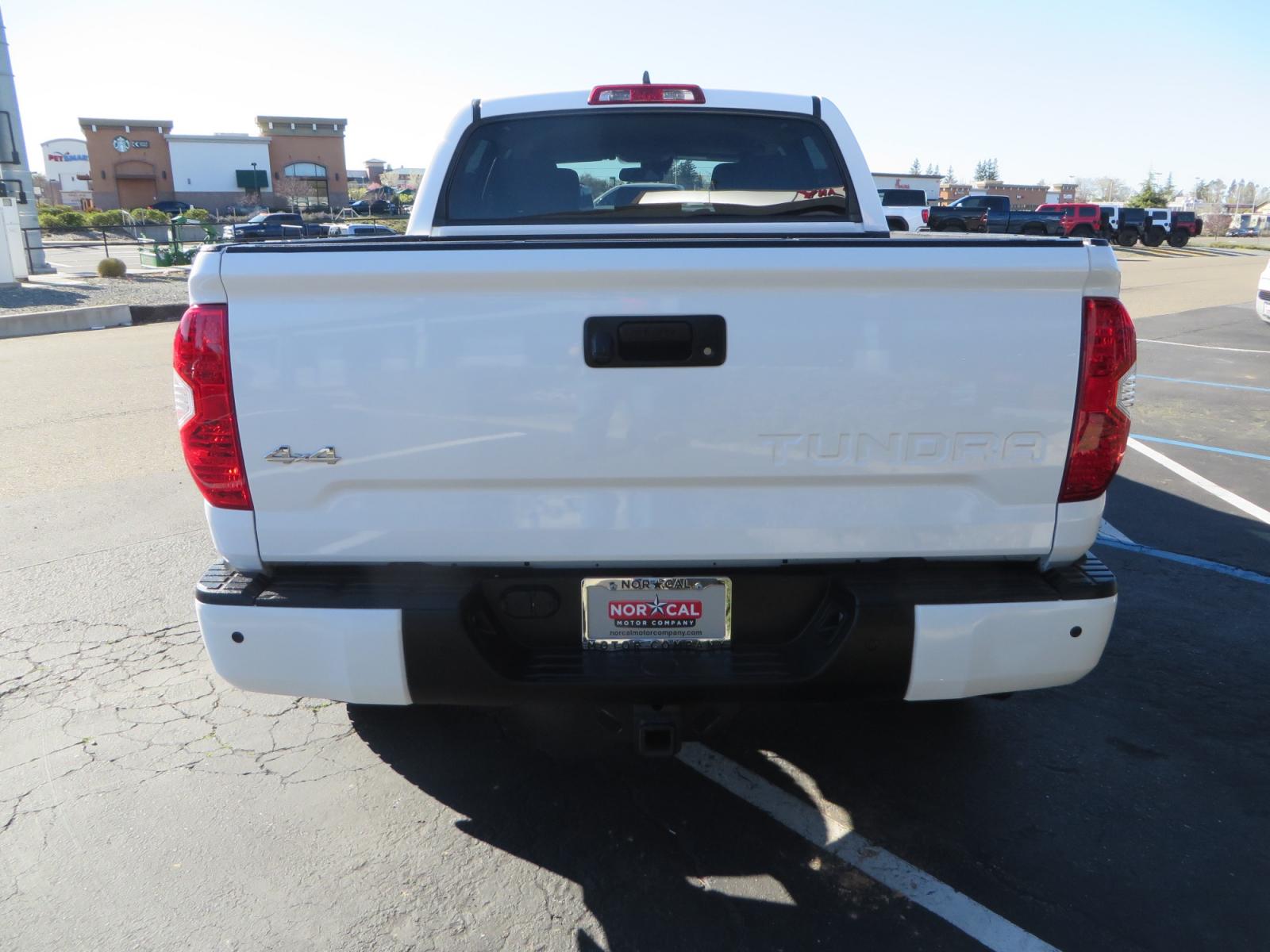 2020 White /GREY Toyota Tundra SR5 (5TFDY5F19LX) with an 5.7L engine, automatic transmission, located at 2630 Grass Valley Highway, Auburn, CA, 95603, (530) 508-5100, 38.937893, -121.095482 - Features - King Off Road adjustable remote reservoir coil overs, King 2.5 adjustable remote reservoir rear shocks, Method Race wheels, Falken Wildpeak tires, Sliders, Bed braces, Borla Exhaust, Husky floor mats, Window tint, and Ram phone mounts. - Photo #5